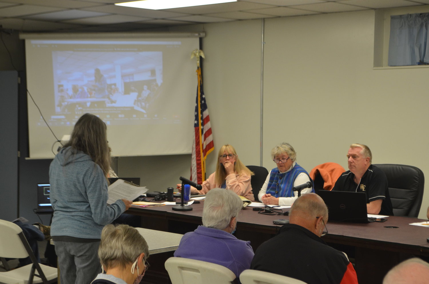 Brandi Merolla, left, speaking before the Tusten town board at its October public hearing.